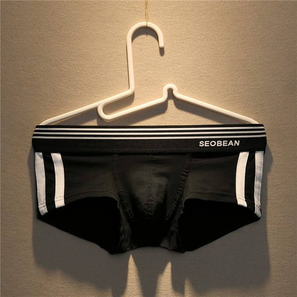 Cotton men's underwear low rise sexy solid color Boxer trendy men's slim fitting breathable sports youth boxer shorts